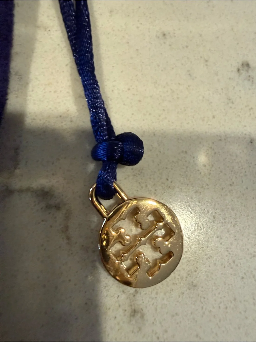 Tory Burch Black Pebbled Leather Tag with Gold-Tone Logo Plate